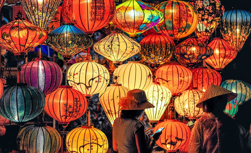 Exploring Hoi An through colourful traditional lanterns illuminating the Ancient Town at night in Vietnam