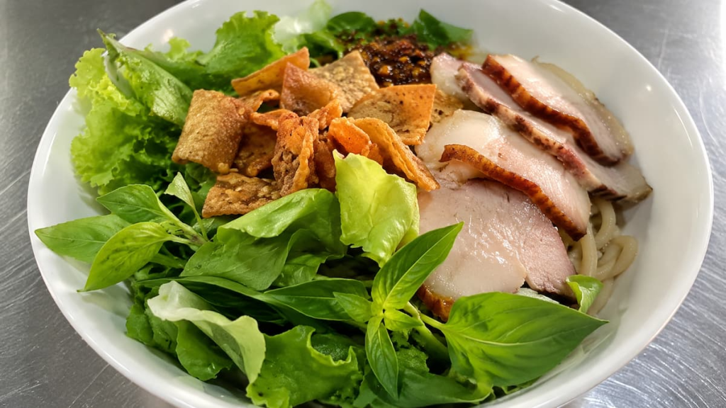 Exploring Hoi An through a traditional bowl of Cao Lầu, the city's signature noodle dish in Vietnam.