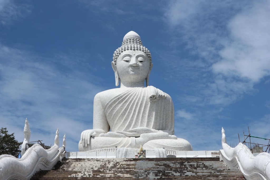 Travel photography tips illustrated with the iconic Big Buddha in Phuket, a landmark commonly photographed by visitors.